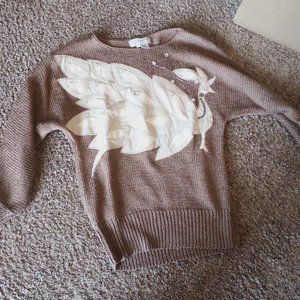 Sweater with leather applique